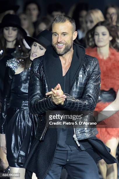 Designer Philipp Plein acknowledges the applause of the audience at the end of the Philipp Plein show during the Milan Fashion Week Autumn/Winter...