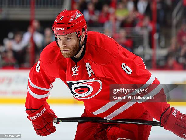 Tim Gleason of the Carolina Hurricanes prepares for a face-off during an NHL game against the Pittsburgh Penguins on December 27, 2013 at PNC Arena...