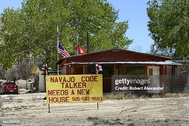 Sign along a highway on the Navajo Indian reservation in New Mexico makes a plea for donations to help find a new home for an elderly Navajo Code...