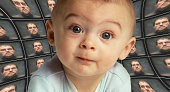Baby facing camera surrounded by distorted screens of Orwellian figure