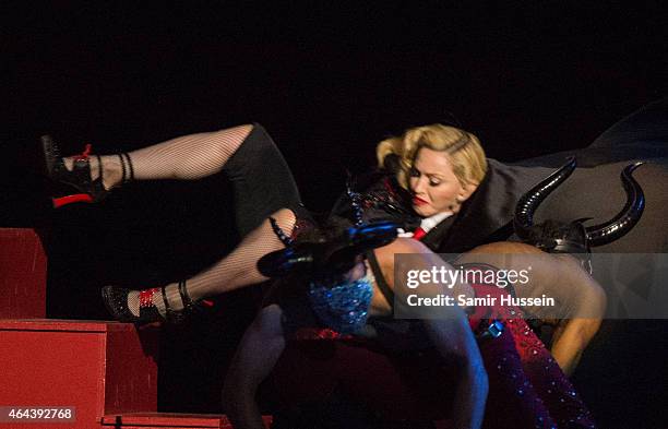 Madonna falls as she performs on stage for the BRIT Awards 2015 at The O2 Arena on February 25, 2015 in London, United Kingdom