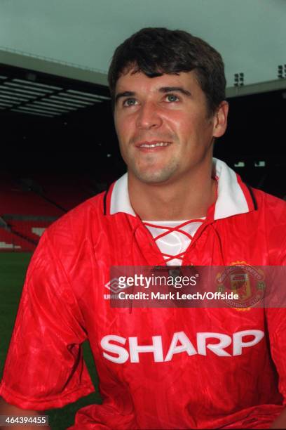 July 1993 - Roy Keane poses in a kit after signing a contract with Manchester United.