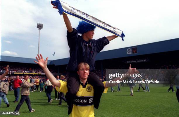 May 1999 - English Football League Division One - Queens Park Rangers v Crystal Palace - Two QPR fans on the pitch celebrating promotion to the...