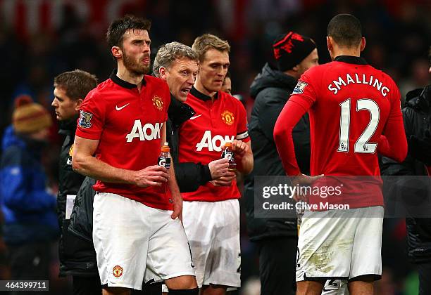 David Moyes the Manchester United manager speaks with his players prior to extra time during the Capital One Cup semi final, second leg match between...