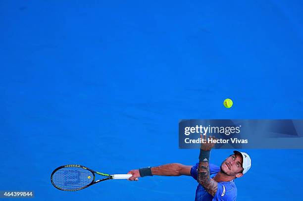 Andreas Haider-Maurer of Austria serves a shot against Alexandr Dolgopolov of Ukraine during a men's singles match as part of Telcel Mexican Open...