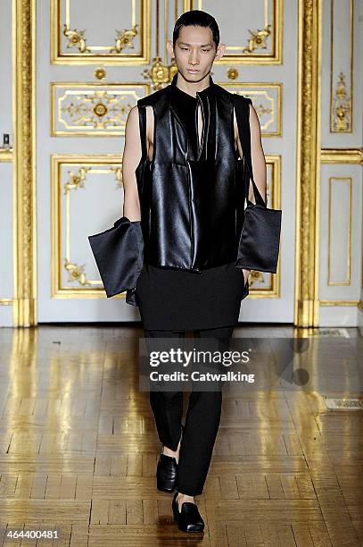 Model walks the runway at the Rad Hourani Spring Summer 2014 fashion show during Paris Haute Couture Fashion Week on January 22, 2014 in Paris,...