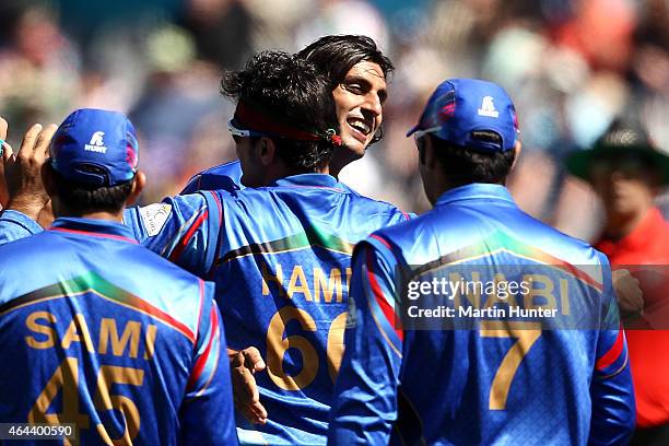 Shapoor Zadran of Afghanistan celebrates with team mates during the 2015 ICC Cricket World Cup match between Afghanistan and Scotland at University...