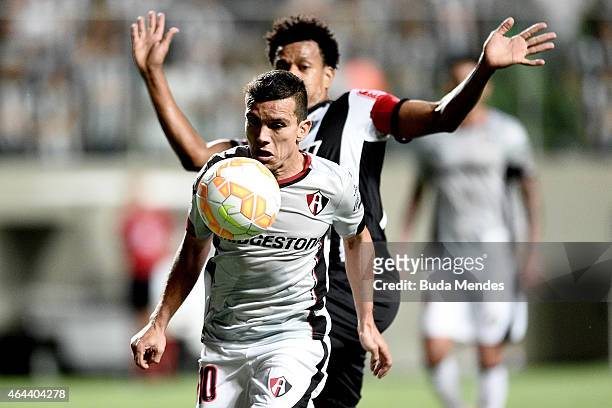 Edcarlos of Atletico MG struggles for the ball with a Juan Pablo Rodríguez of Atlas during a match between Atletico MG and Atlas as part of Copa...