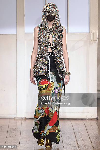Model walks the runway at the Maison Martin Margiela Spring Summer 2014 fashion show during Paris Haute Couture Fashion Week on January 22, 2014 in...