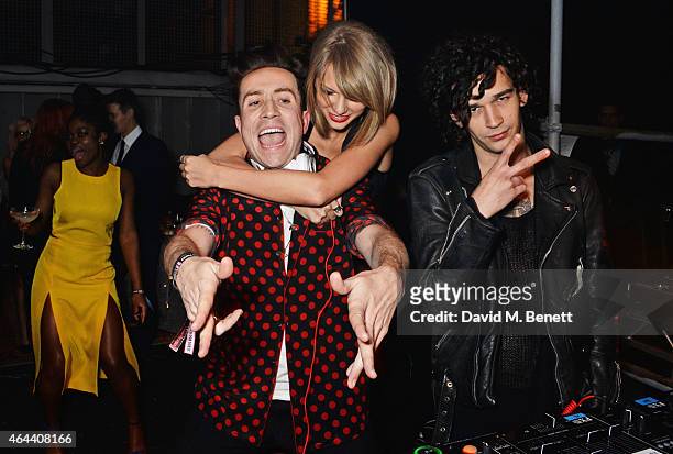 Nick Grimshaw, Taylor Swift and Matt Healy attends the Universal Music Brits party hosted by Bacardi at The Soho House Pop-Up on February 25, 2015 in...