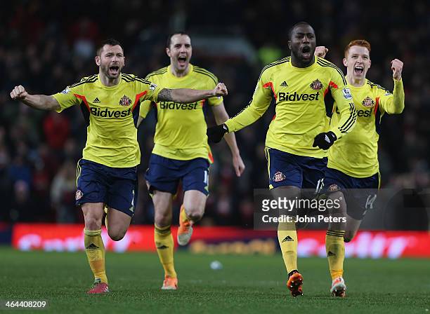 Phil Bardsley; John O'Shea, Jozy Altidore and Jack Colback of Sunderland celebrate at the end of during the Capital One Cup semi-final second leg at...