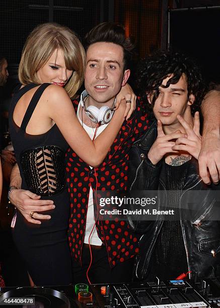 Taylor Swift, Nick Grimshaw and Matt Healy attend the Universal Music Brits party hosted by Bacardi at The Soho House Pop-Up on February 25, 2015 in...