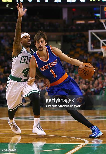Alexey Shved of the New York Knicks drives past Isaiah Thomas of the Boston Celtics during the second quarter at TD Garden on February 25, 2015 in...