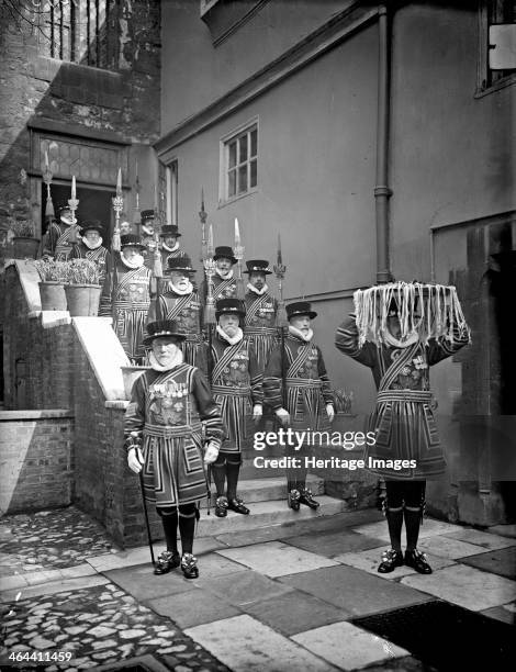 Detachment of Yeomen of the Guard in ceremonial dress escort the Maundy Money across the Abbots Courtyard, Dean's Yard, Westminster Abbey, London.