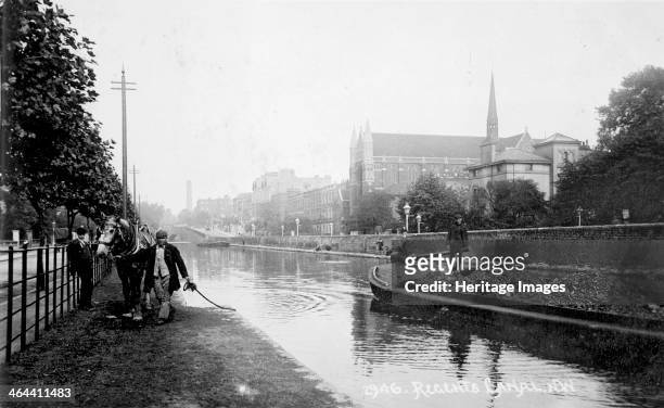 Regent's Canal, part of the Grand Union Canal, London, 1893-1905. Seen from the corner of Warwick Avenue. A coal barge is making its way along the...