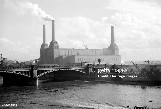 Battersea Power Station, London, c1945-c1965. Viewed from the north-west with Grosvenor Railway Bridge in front. It was built in 1929-1935, with Sir...