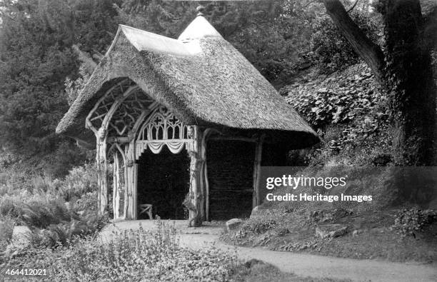 Rustic thatched summerhouse in the grounds of Belvoir Castle, Leicestershire, erected c1810, . The entrance archway is fashioned out of tree branches...