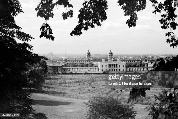 The Queen's House with the Royal Naval Hospital behind, viewed from Greenwich Park, Greenwich, London, c1945-c1965. In front of the Queen's House...