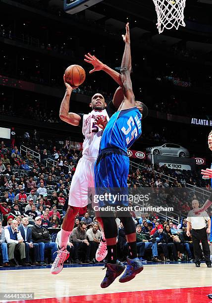 Al Horford of the Atlanta Hawks puts up a shot against Bernard James of the Dallas Mavericks on February 25, 2015 at Philips Arena in Atlanta,...