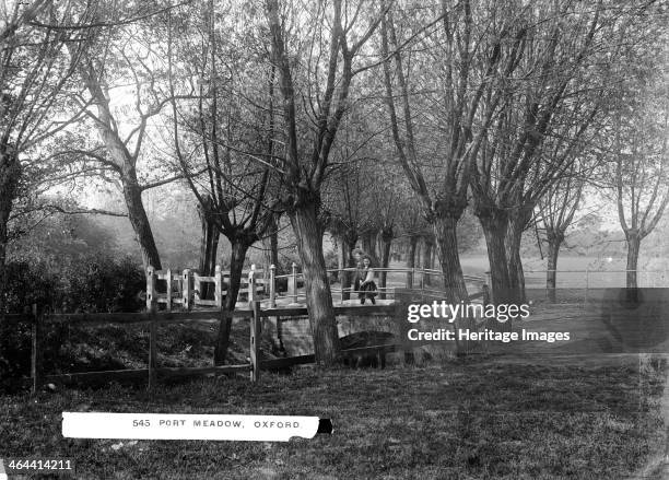 Two schoolgirls crossing the bridge, Port Meadow, Oxford, Oxfordshire, c1860-c1922.