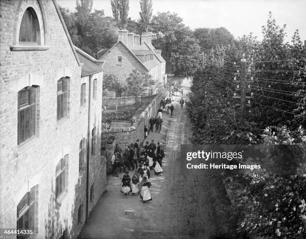 Workers on their way to work at the Early Blanket Factory, Witney, Oxfordshire, c1860-c1922.