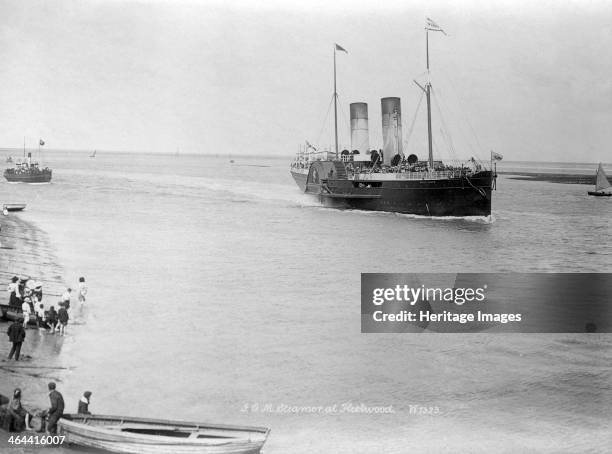 The Isle of Man paddle steamer, Fleetwood, Lancashire, 1890-1910. A group of people watch the Isle of Man paddle steamer approaching Fleetwood. The...