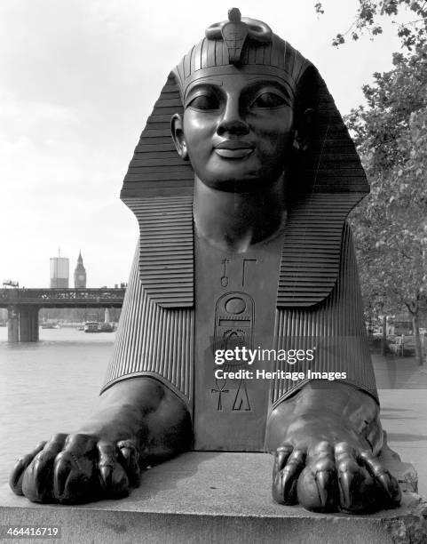Sphinx guarding Cleopatra's Needle, Westminster, London. A close-up view of the front of one of the two sphinxes. They were sculpted in 1878-1879 at...