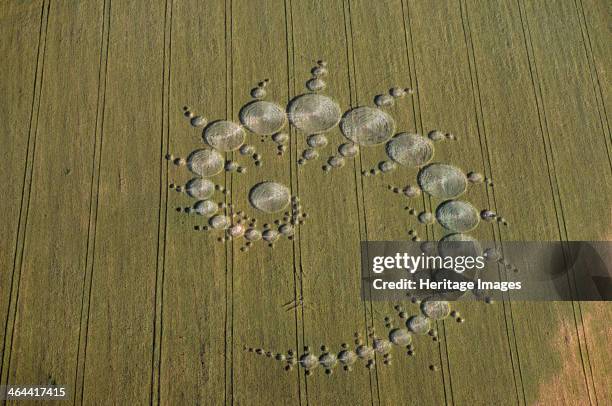 Crop circles, Stonehenge Down, Wiltshire, 1996. Some people regard crop circles as evidence of UFO contact or spiritual activity. Others believe they...