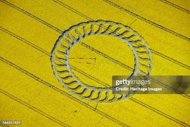 Crop circle near West Kennet, Wiltshire, 1998. Some people regard crop circles as evidence of UFO contact or spiritual activity. Others believe they...