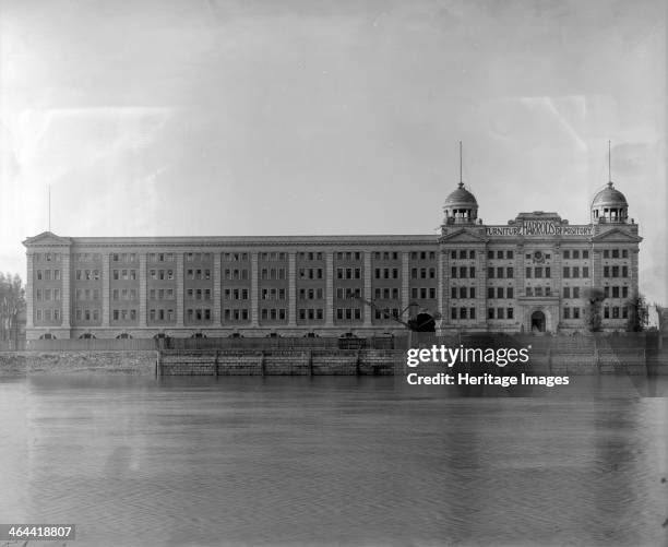 Harrods Furniture Depository, Riverview Gardens, Barnes, London, 1921. The Depository has its own river quay with a crane to lift heavy items.