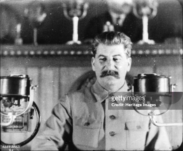 Soviet leader Josef Stalin giving a speech at the Congress of the Communist Party, 1930s. Born Iosif Vissarionovich Dzugashvili, Stalin played a...