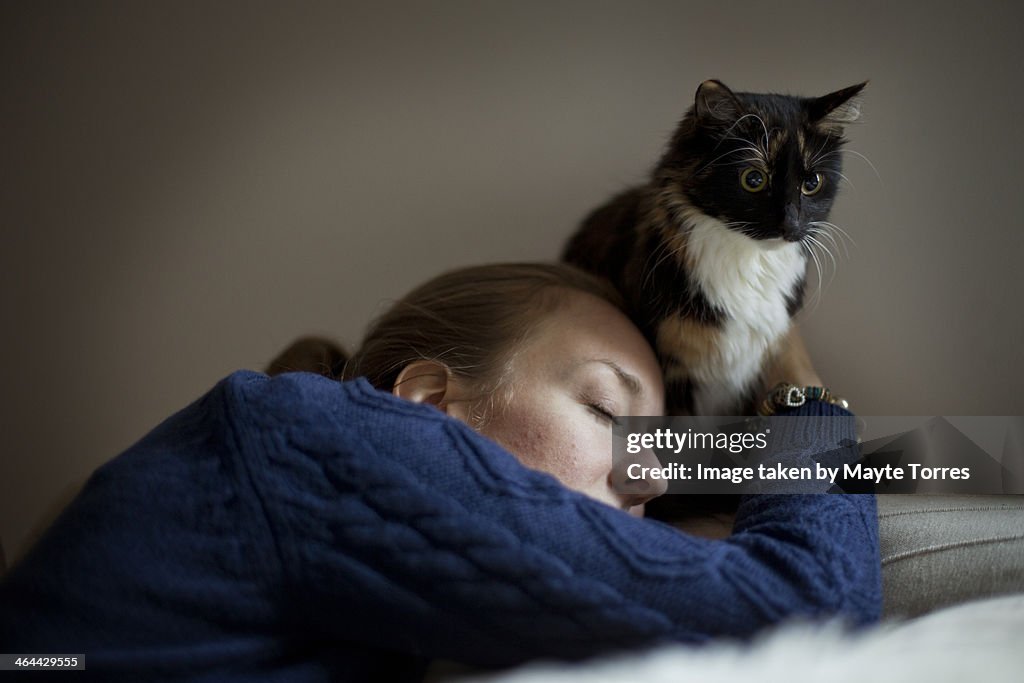 Woman hugging cat