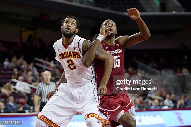 Malik Martin of the USC Trojans battles for position against Junior Longrus of the Washington State Cougars in the second half at Galen Center on...