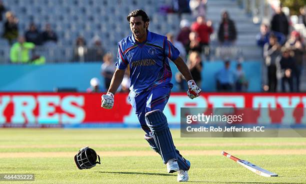 Shapoor Zadran of Afghanistan celebrates their win over Scotland during the 2015 ICC Cricket World Cup match between Afghanistan and Scotland at...