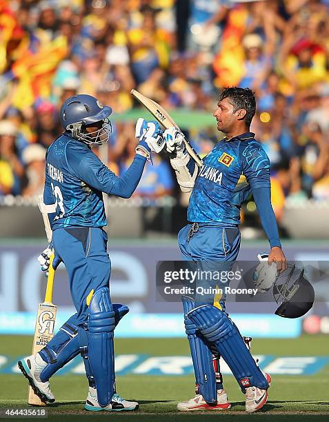 Tillakaratne Dilshan congratulates Kumar Sangakkara of Sri Lanka for reaching his century during the 2015 ICC Cricket World Cup match between Sri...