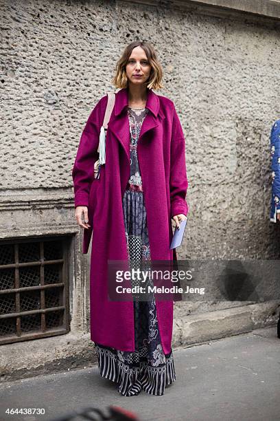 Candela Novembre attends the Fay show in a Blumarine coat, Alberta Ferretti dress, Jimmy Choo shoes, and Sara Battaglia bag on February 25, 2015 in...