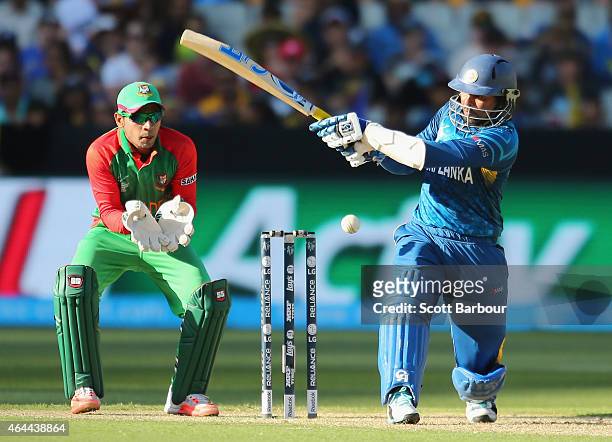 Tillakaratne Dilshan of Sri Lanka bats as wicketkeeper Mushfiqur Rahim of Bangladesh looks on during the 2015 ICC Cricket World Cup match between Sri...