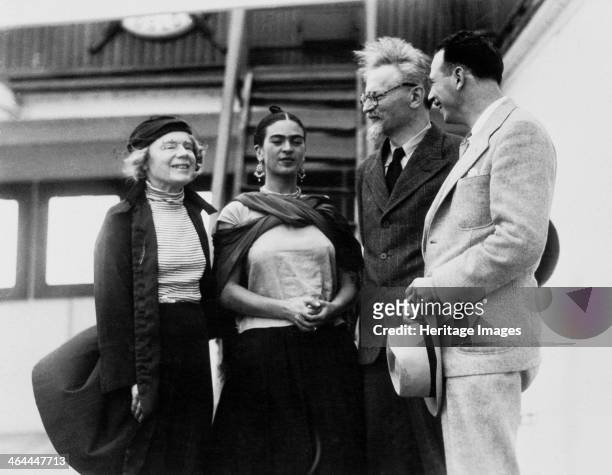 Russian Marxist revolutionary Leon Trotsky and his second wife, Natalia Sedova , are greeted by Mexican painter Frida Kahlo and Polish-born American...