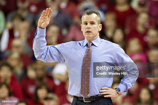 Head Coach Billy Donovan of the Florida Gators signals to his team during a game against the Arkansas Razorbacks at Bud Walton Arena on January 11,...