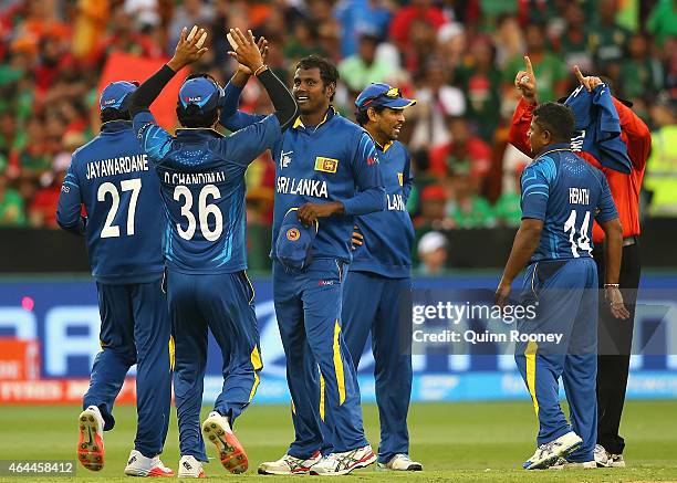 Angelo Mathews of Sri Lanka is congratulated by team mates after running out Anamul Haque of Bangladesh during the 2015 ICC Cricket World Cup match...