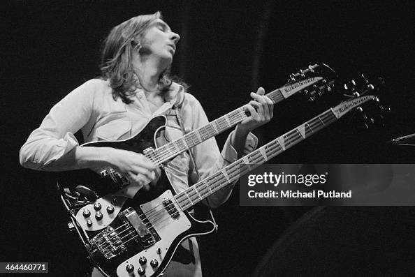 Mike Rutherford playing a Rickenbacker double neck guitar/bass during ...