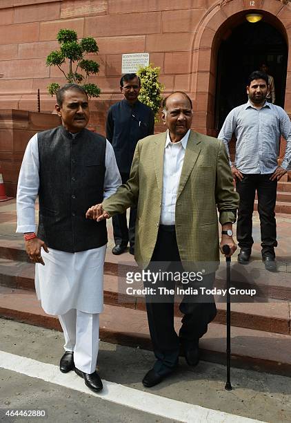 Sharad Pawar with Praful Patel on the first day of budget session in New Delhi.