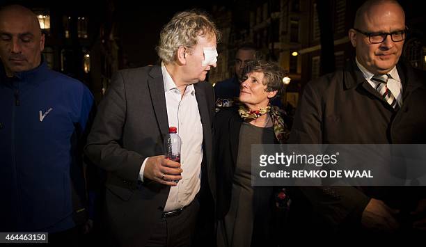 Mayor Eberhard van der Laan leaves together with Louise Gunning, head of the Executive Board of the universitys administration centre, as students...