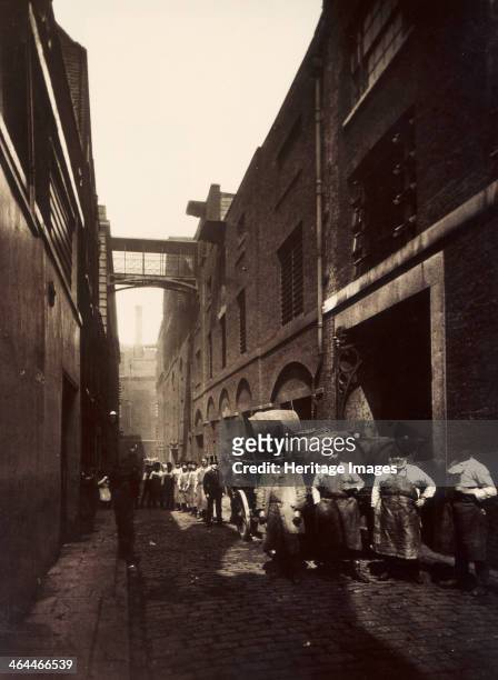 Brewery workers outside the Combe & Co's Brewery, Castle Street, St Giles Circus, London, c1875.