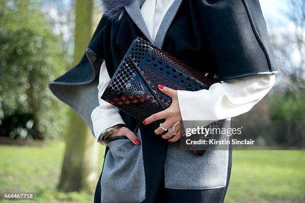 Fashion writer Nausheen Shah wears a Jocylen coat, Yapianna bag, and Paula Mandozer ring. On day 4 of London Collections: Women on February 23, 2015...