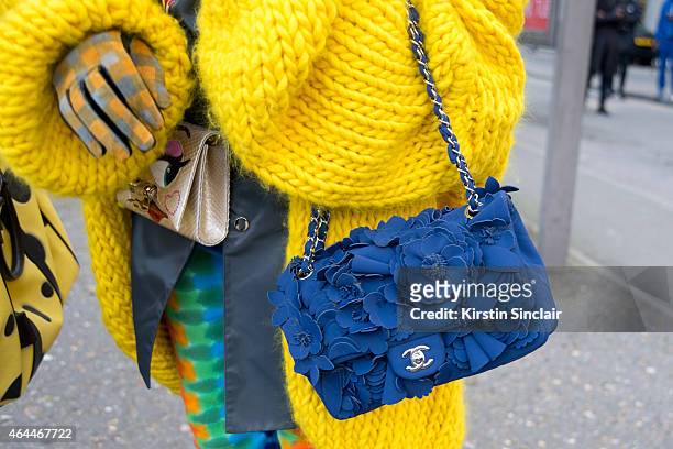 Fashion blogger Cailli Beckerman wears Mr Mittens jacket Sankuanz coat, Chanel bag, Etsy trousers on day 4 of London Collections: Women on February...
