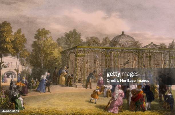 The Monkey House at the Zoological Gardens, Regent's Park, London, 1835. Families on a day out at the zoo crowd in front of the monkeys' cage.