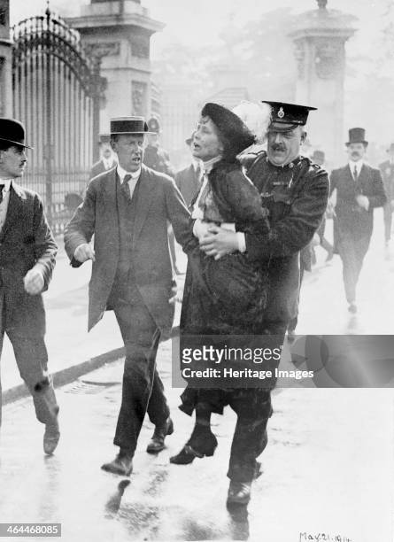 Emmeline Pankhurst arrested by Superintendent Rolfe outside Buckingham Palace, London, May 1914. Mrs Pankhurst was trying to present a petition to...