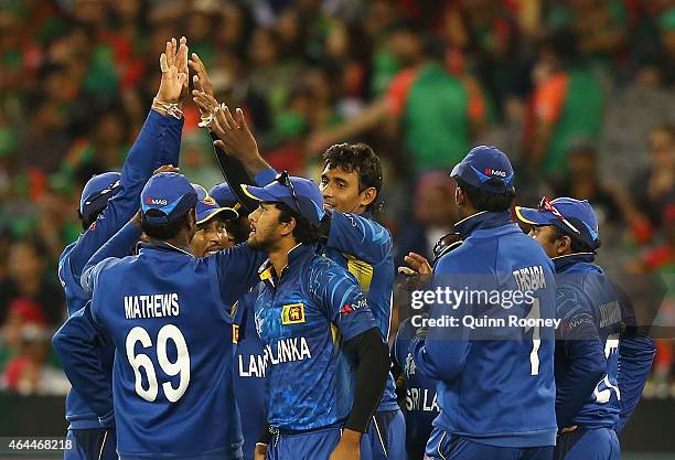 Suranga Lakmal of Sri Lanka is congratulated by team mates after getting the wicket of Mushfiqur Rahim of Bangladesh during the 2015 ICC Cricket...