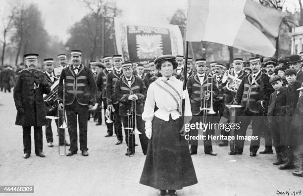 Daisy Dugdale leading the procession to welcome Emmeline and Christabel Pankhurst, London, 19th December 1908. Wearing the suffragette uniform in the...